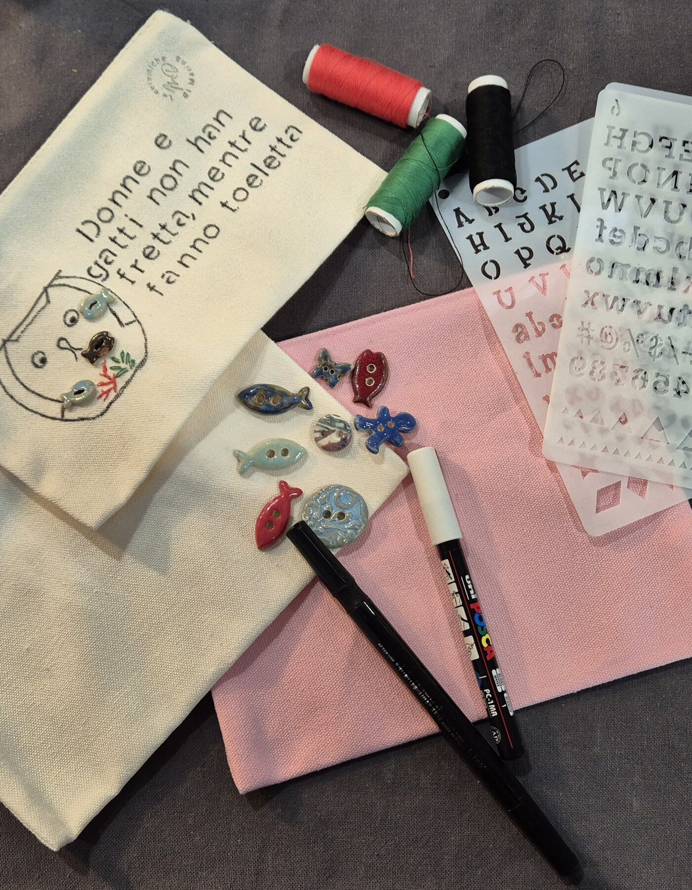 Decoration with writing and ceramic buttons of clutch bag